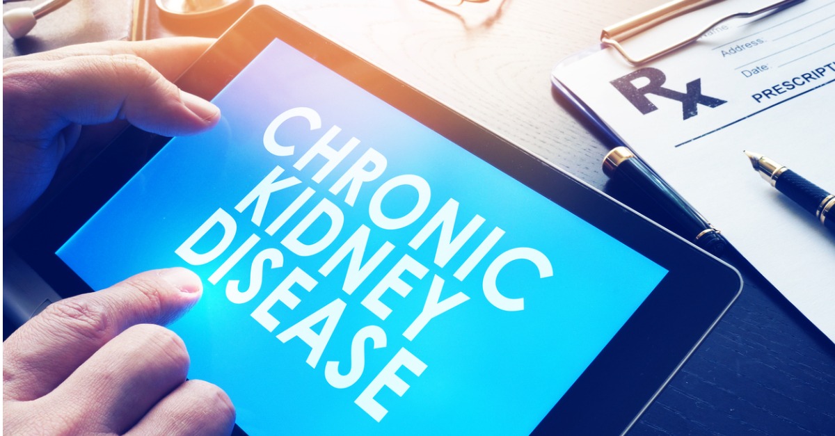 Doctor reading about chronic kidney disease on iPad